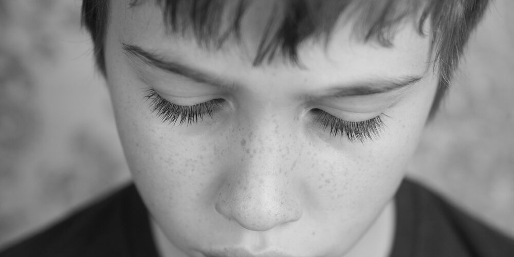 pensive  or sad teen boy