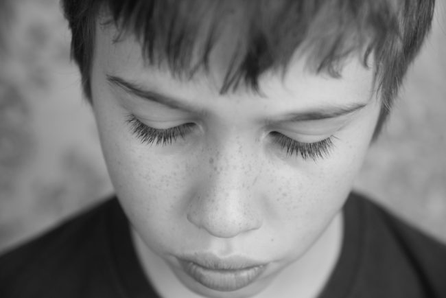 pensive  or sad teen boy