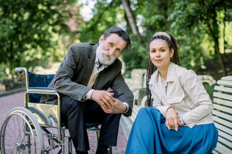 Hipster,Female,Social,Worker,And,Old,Bearded,Disabled,Man,In