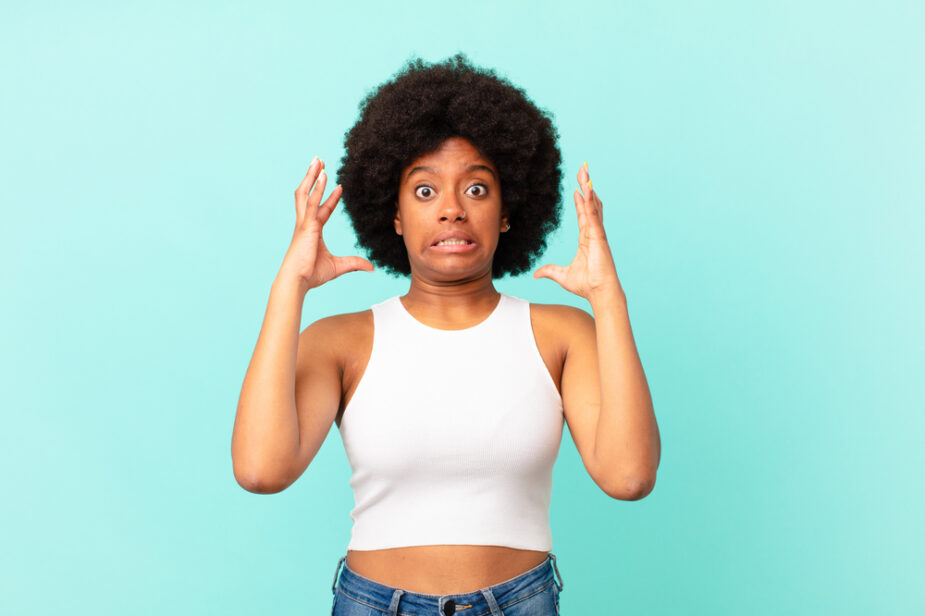 Afro,Black,Woman,Screaming,With,Hands,Up,In,The,Air,