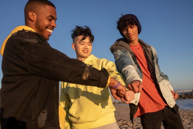 Hands,Together,,Best,Friends,Teen,Boys,On,The,Beach