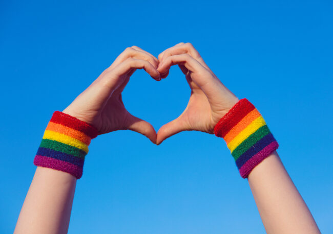 Gay,Pride,Concept.,Hand,Making,A,Heart,Sign,With,Gay